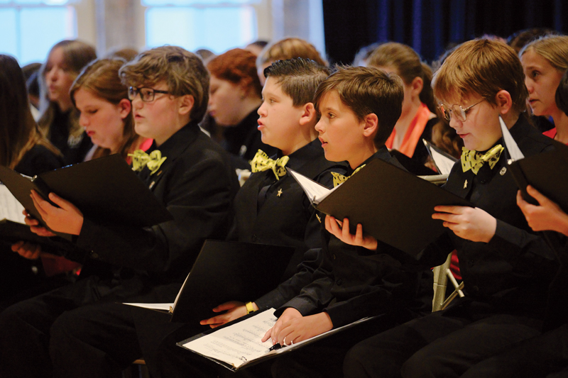 The Cincinnati Boychoir warms up with the May Festival Youth Chorus and Cincinnati Youth Choir in advance of their performance of Mahler’s Symphony of a Thousand. (Credit: JP Leong)