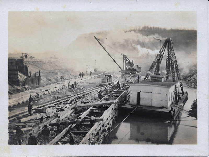 Construction of Pilcher Dam/Lock and Dam No. 43 with heavy machinery on the Ohio River c. 1914–c. 1920 (Credit: James Scott Bryant Collection via the Bobbie Smith Bryant Donation, Office of History, HQ, U.S. Army Corps of Engineers).