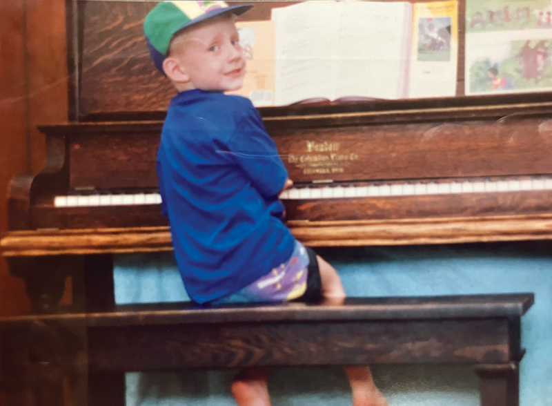 Matthew Swanson at age 4, playing the piano at home. 